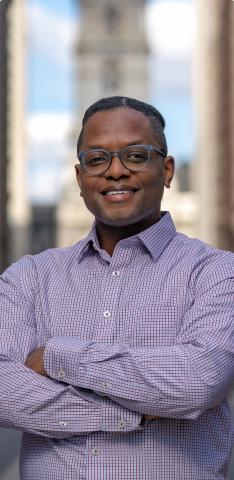 Darnelle Radford on the broad street median facing south with City Hall at his back